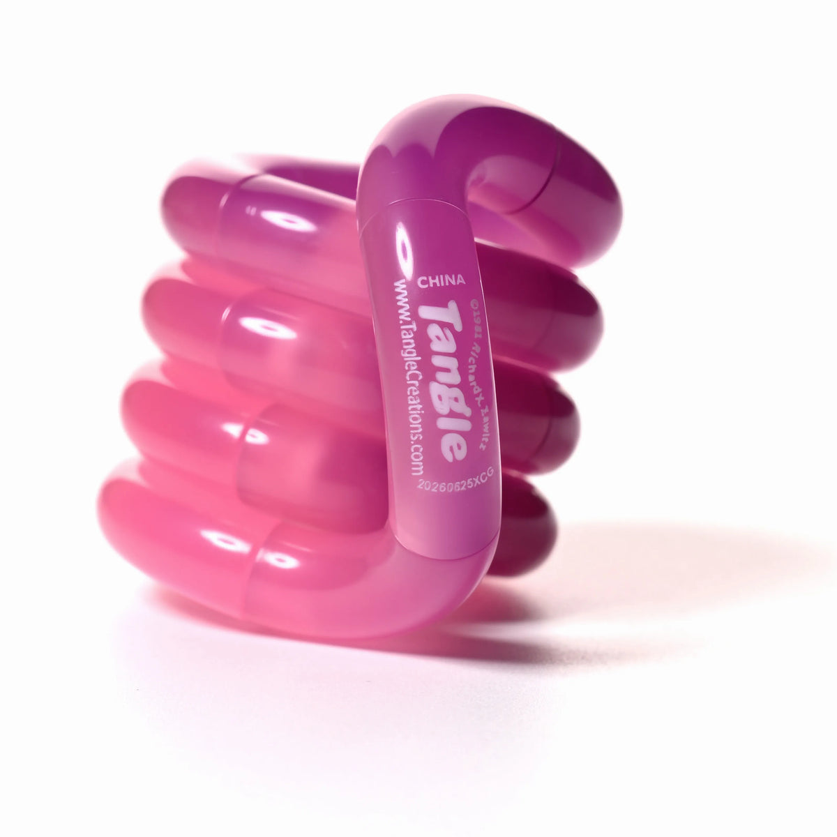 Tangle® Jr Bubblegum rose translucide, fidget à manipuler
