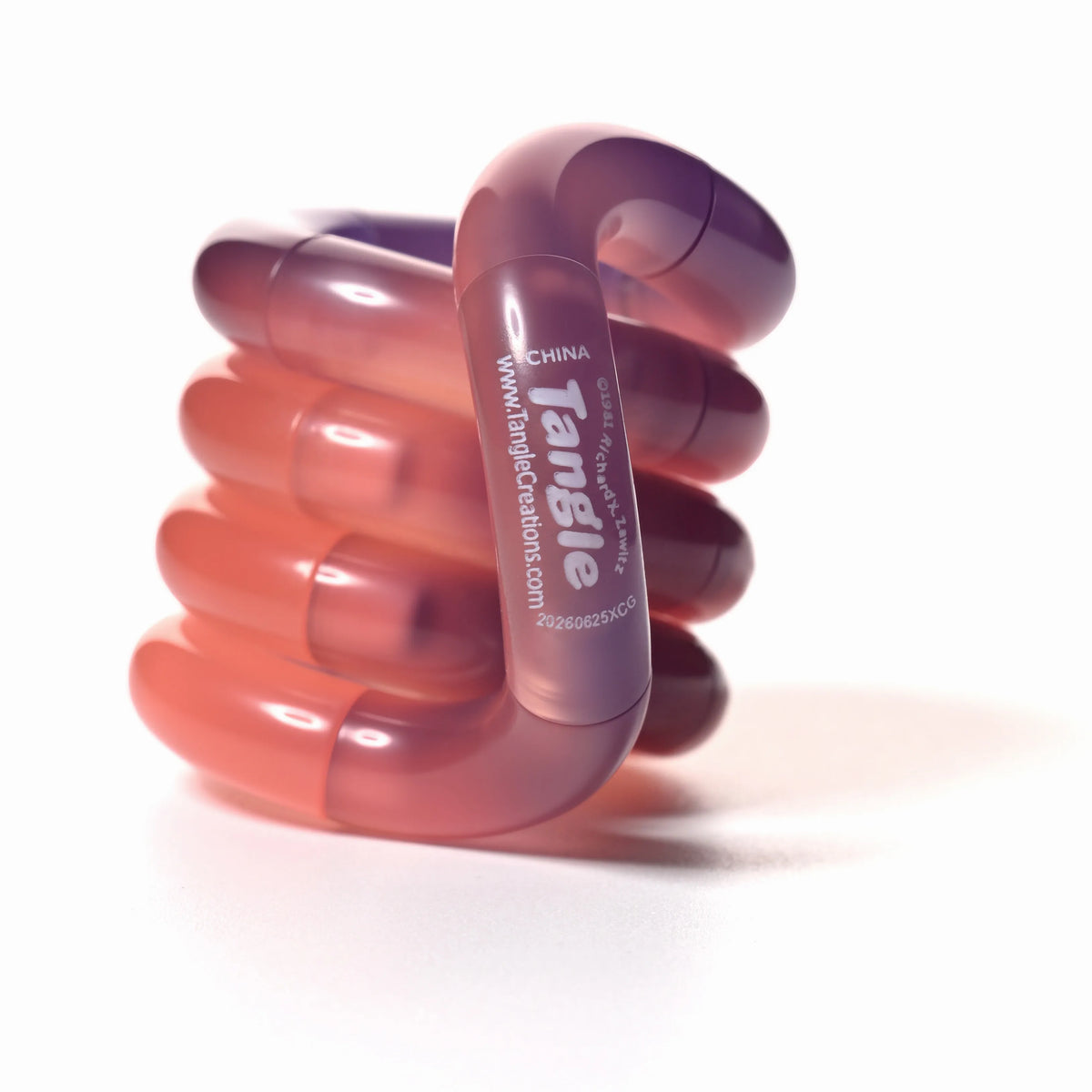 Tangle® Jr Bubblegum orange et violet translucide, fidget à manipuler