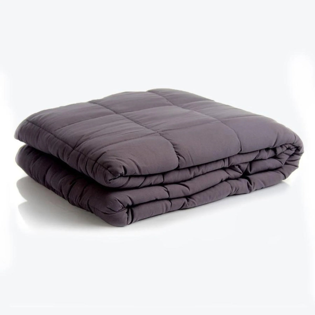 Couverture lestée Slumber gris anthracite pliée, avec compartiments cousus en carrés.