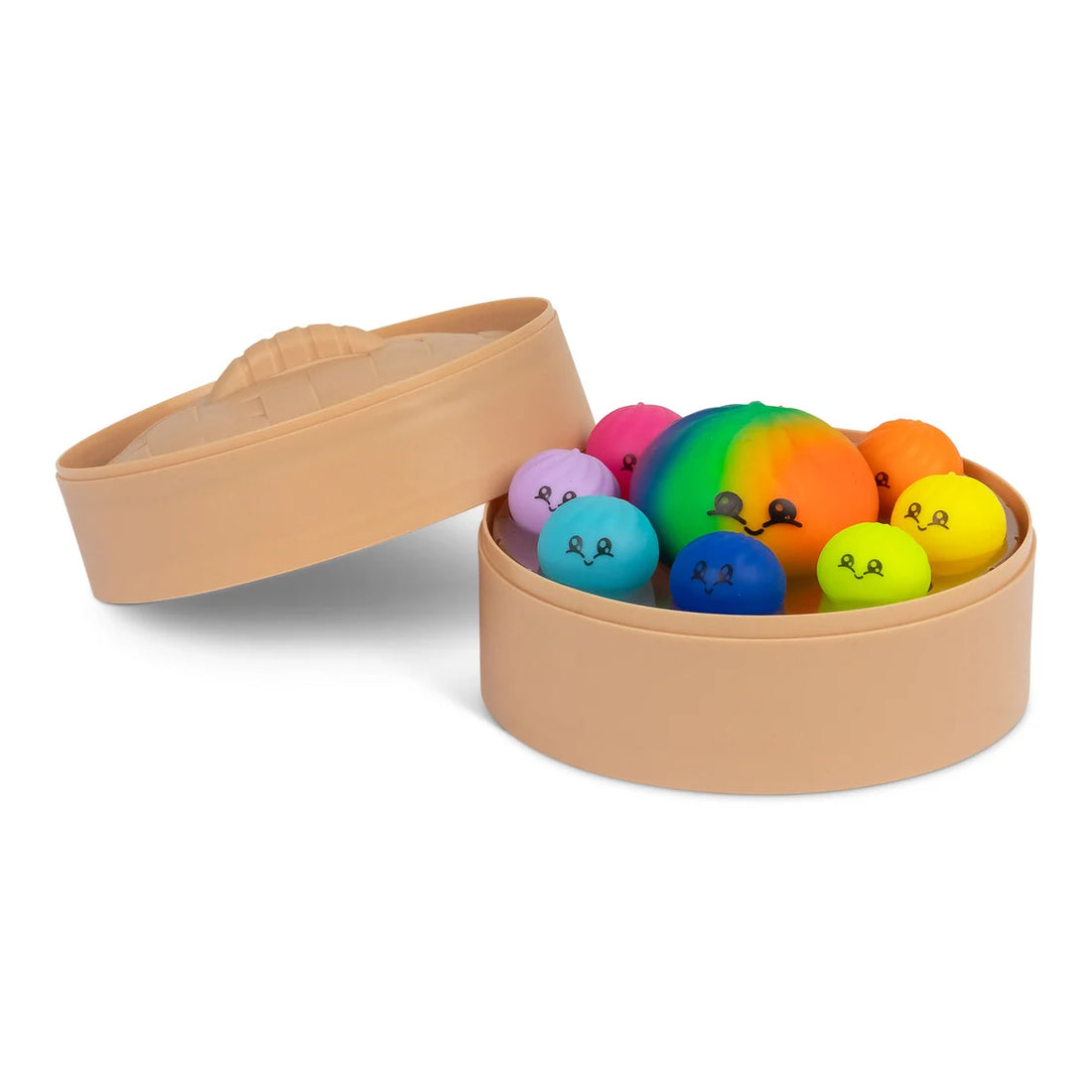 Squishies antistress colorés rangés dans leur panier vapeur, couvercle posé à côté